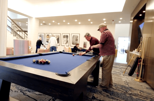 The Arbor Company senior residents playing pool