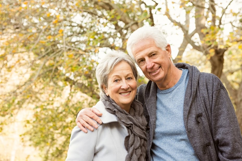 Senior couple in the park on an autumns day